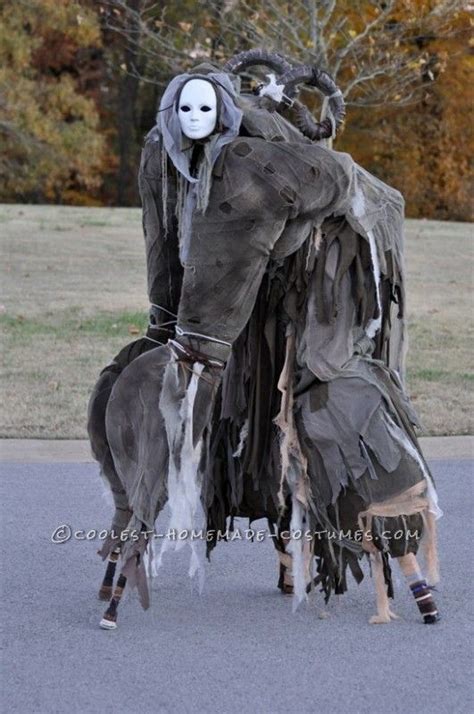 4 legged creature costume|four legged stilt spirit.